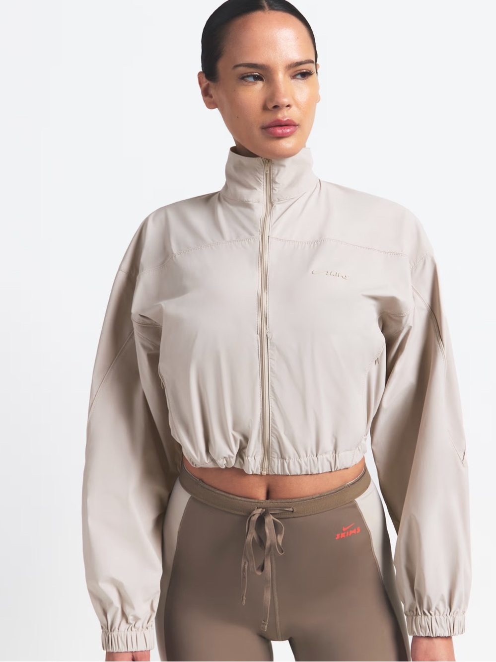 Skims x Nike Woven Nylon Cropped Jacket in Stone size XXS